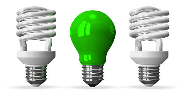 istock Green tungsten light bulb and two white spiral ones 513254841