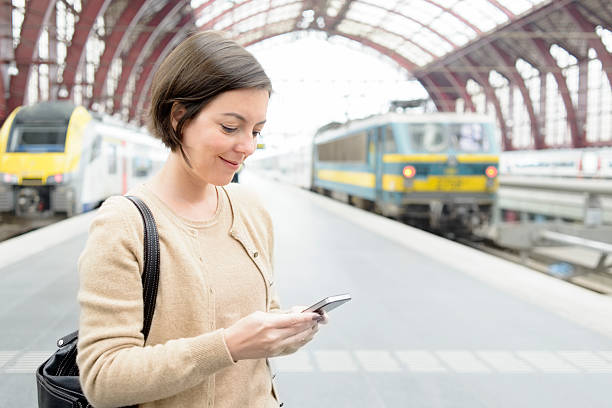 istock Travel - Using Smartphone at Railway Station 513255947