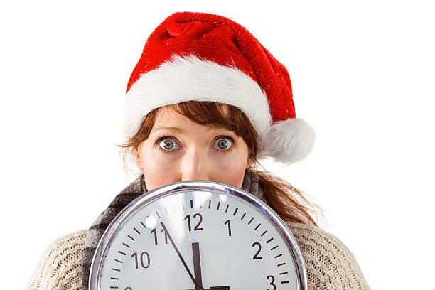istock Woman holding a large clock 513256961