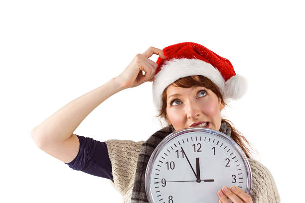 istock Woman holding a large clock 513256963