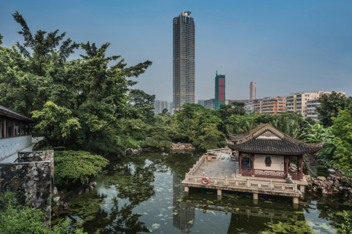 pagoda temple by pond at Kowloon Walled City Park in Hong Kong