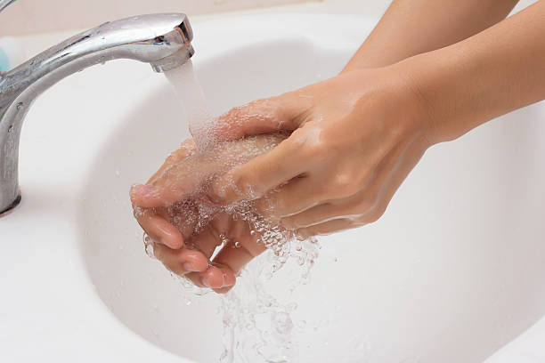 istock Woman washing hands with soap . 513270289