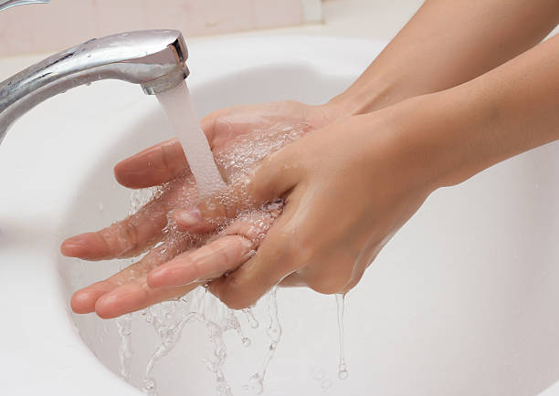 istock Woman washing hands with soap . 513271293