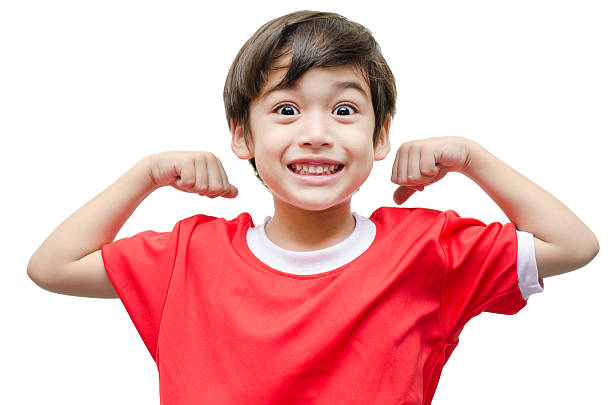 istock Little boy showing his muscles on white background 513273599