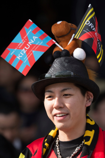 Paris, France - October 6, 2013: A Japanese racing fan supporting Orfevre and Kizuna during the Prix de l'Arc de Triomphe race day at Longchamp racecourse on October 06, 2013 in Paris, France.