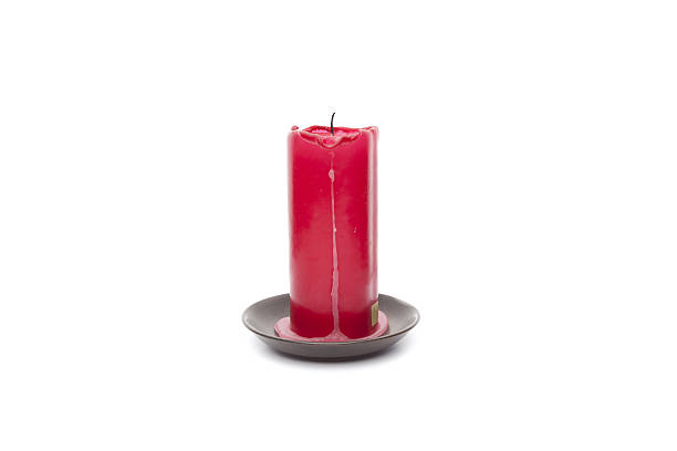 istock Red candle with wax isolated on white background 513288377