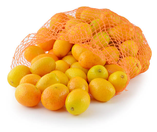 istock Fresh orange in plastic netting sack on white background 513290127