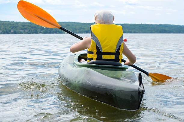 istock Young girl kayaking 513293489