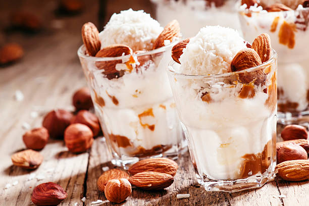 istock Dessert with vanilla ice cream, nut sauce, almond 513293826