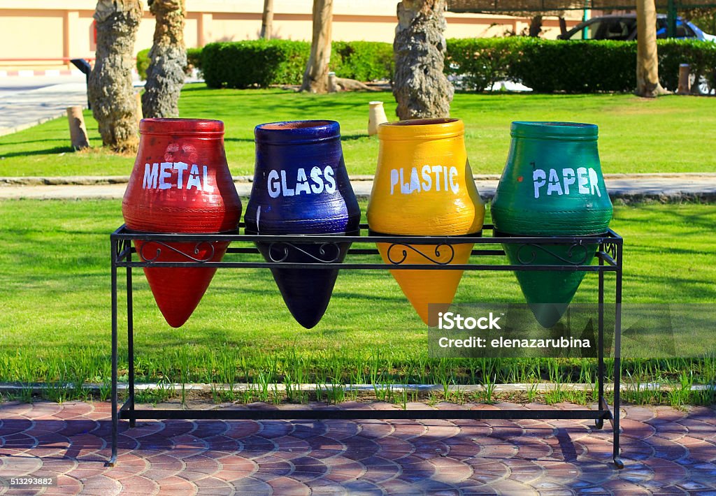 garbage separation and recycling rubbish bins outside in the street for separate garbage disposal for metal, glass, plastic and paper Container Stock Photo