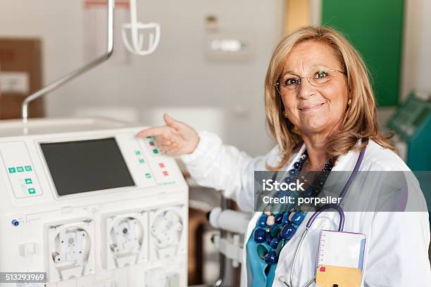 Doctor Showing A Dialyser Stock Photo - Download Image Now - Dialysis Machine, Dialysis, Dialysis Filter