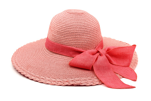 Pink straw hat with bow isolated on white