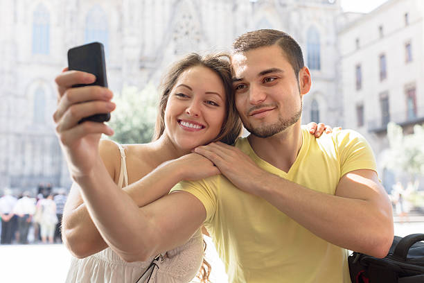 istock Couple doing selfie at the street 513294811