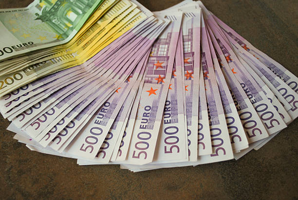 istock Cash Euro banknotes spread out on the table. 513295736