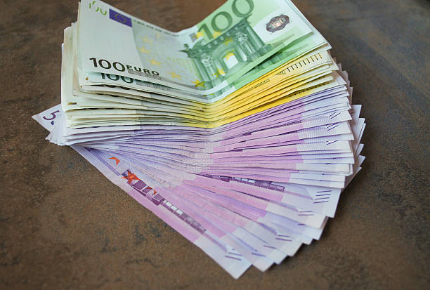 istock Cash Euro banknotes spread out on the table. 513295796