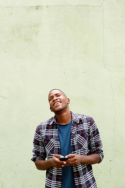 istock Happy young guy with a mobile phone 513296766