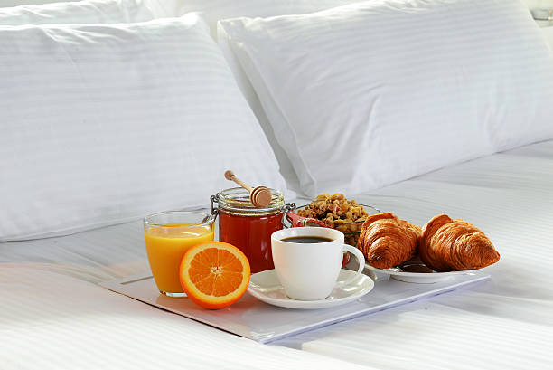 istock Breakfast in bed in hotel room. 513296854