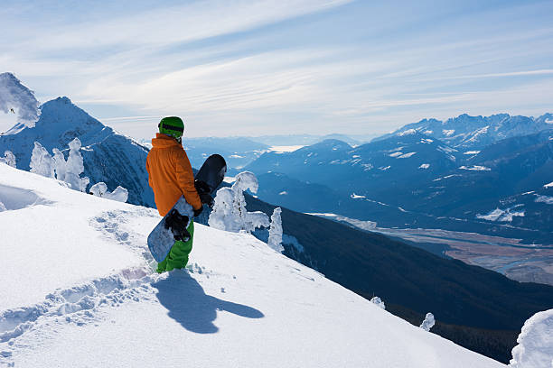 Snowboarder enjoying stunning views at Revelstoke Mountain Resort