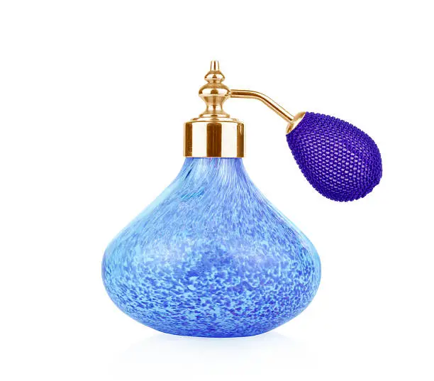 Photo of Blue vintage perfume bottle with atomizer isolated