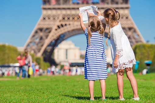 Adorable little girls in Paris background the Eiffel tower in France