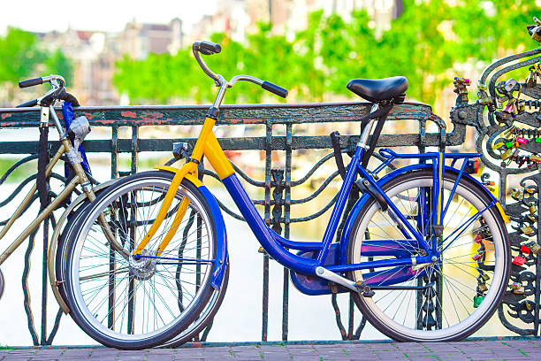 istock Colorful bikes on streets in Amsterdam, Netherlands 513299128