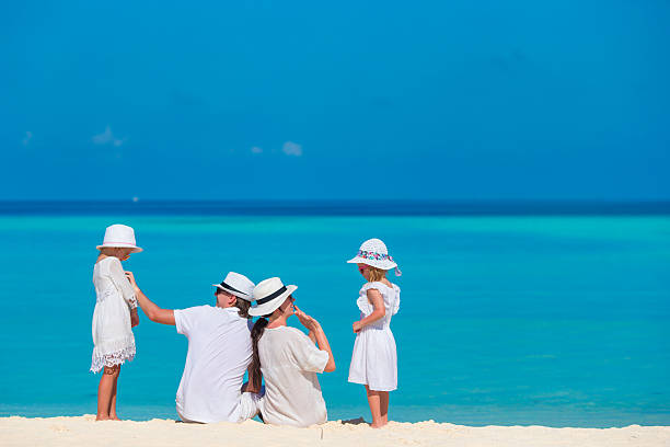 istock Happy family on beach vacation 513299448