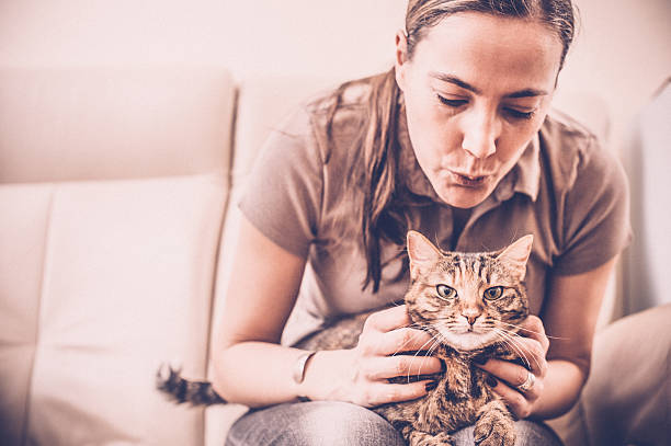 istock Woman having fun with a Cat 513299844