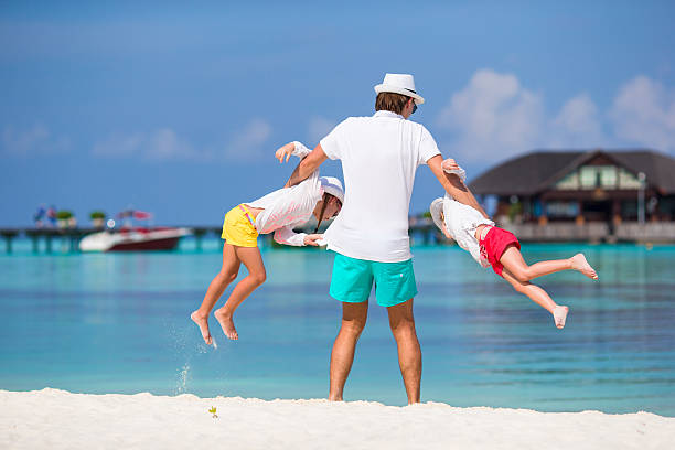 istock Happy family beach vacation 513300730