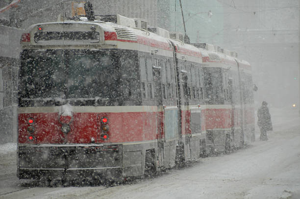 streetcar snowstorm streetcar in toronto under snowstorm sustainable energy toronto stock pictures, royalty-free photos & images