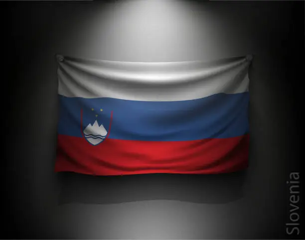 Vector illustration of waving flag slovenia on a dark wall