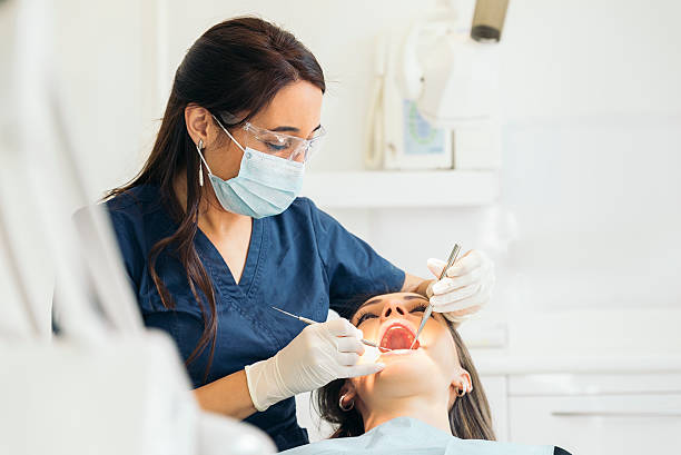istock Dentists with a patient during a dental intervention. 513302120
