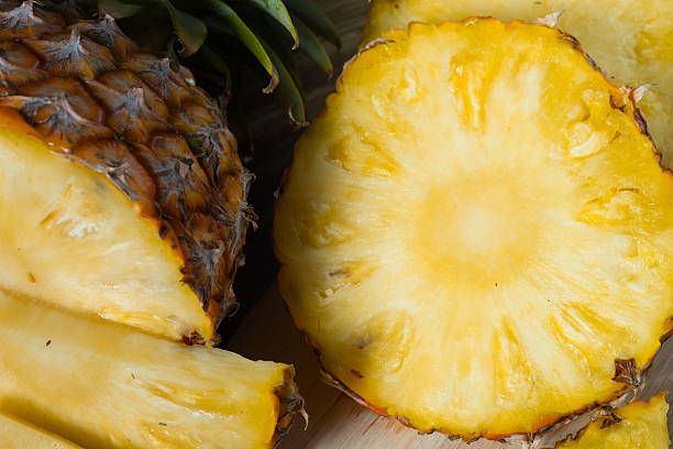 istock pineapple on the wood texture background 513302218