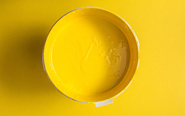 Yellow paint box on yellow background