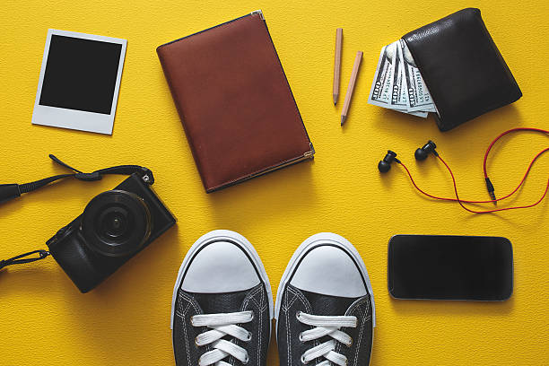 istock Outfit of traveler different objects on yellow background 513305882