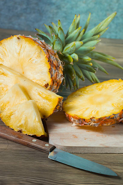 istock pineapple on the wood texture background 513307034