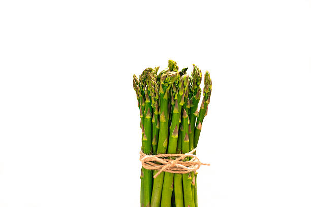 istock Vibrant Asparagus Bunch; White Background 513307274