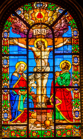 Paris, France - May 30, 2015: Crucifixion Jesus Virgin Mary Marcy Magdeline Stained Glass Saint Louis En L'ile Church Paris France. Saint Louis En L'ile church built in Notre Dame was built in 1726 on the island in back of Nortre Dame.