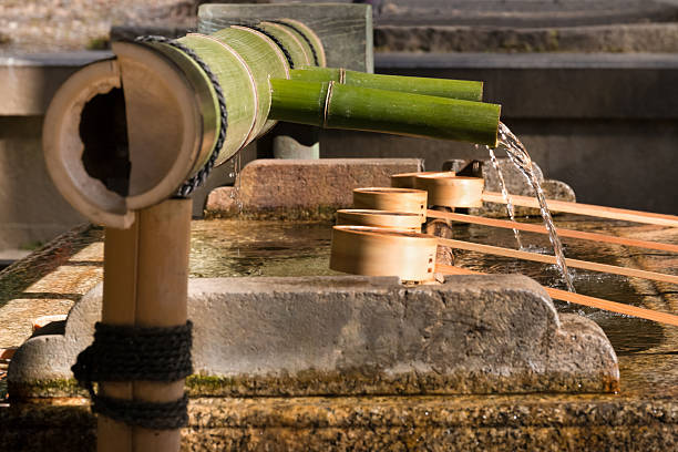 istock Water basin and purification ladles at shinto temple 513308124