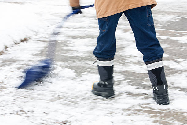 istock pushing the snow with curved snow shovel 513309268