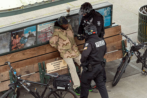 Seattle Crime Seattle, USA -March 2, 2016: Seattle Police arresting a man mid day in Pike Place Market for allegedly selling drugs after police witness an exchange. german social democratic party photos stock pictures, royalty-free photos & images