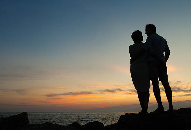 istock Loving couple sunset silhouette 513311048