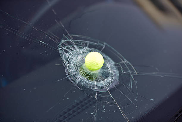 Golf Ball through the window stock photo