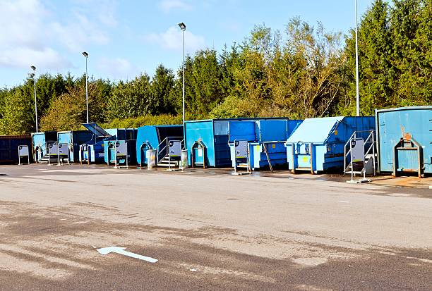 recycling center Containers at a recycling center in Denmark. There are centers in or around most cities in Denmark where people can bring their trash and sort it in containers at the center. This service is free for private people. recycling center stock pictures, royalty-free photos & images