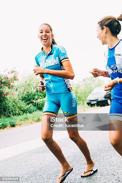 Female Runners At Tour De France Festivities Stock Photo - Download Image Now - Tour de France, Active Lifestyle, Adult