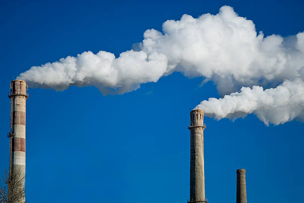 istock Plant tubes and white smoke against blue sky 513315222