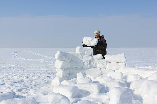 istock The man building an igloo of snow blocks 513315844