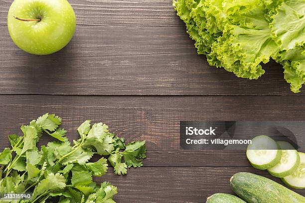 Green Vegetables And Green Fruit On Rustic Wood Table Stock Photo - Download Image Now