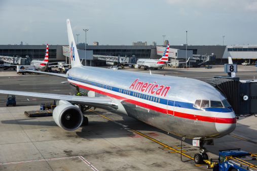New York, USA - September 10, 2014: American Airlines Boeing 767 at New York JFK airport with some more aircrafts on background