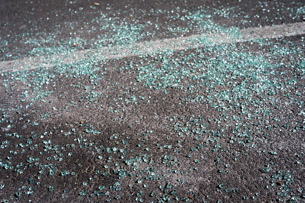 istock Broken car glass on an asphalt 513317348