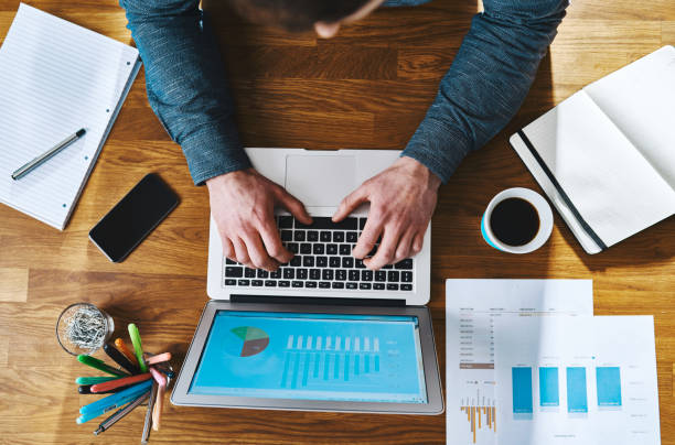 istock Top view working at desk with laptop 513318100